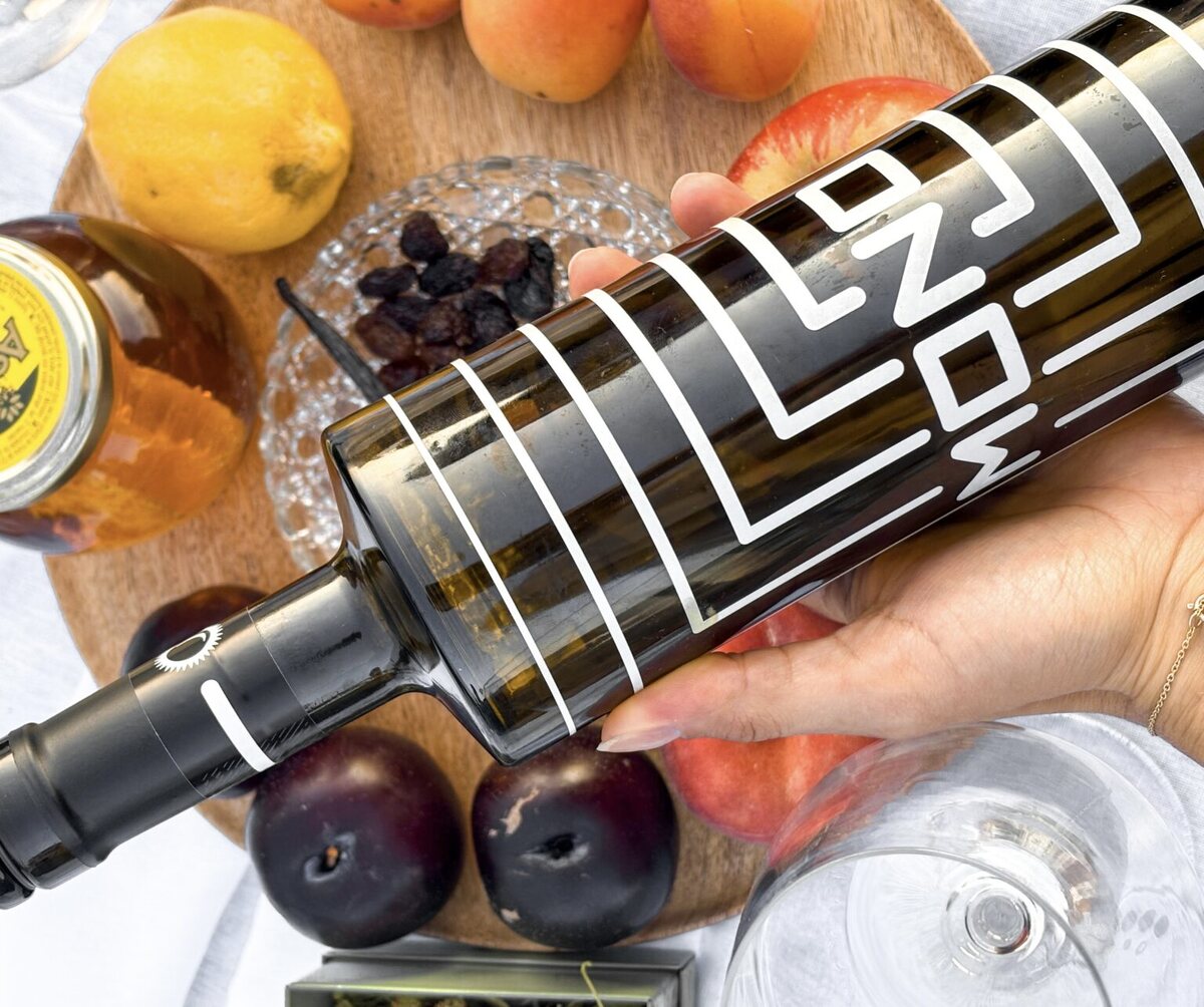 Wine, fruit and glasses arranged on a tasting table
